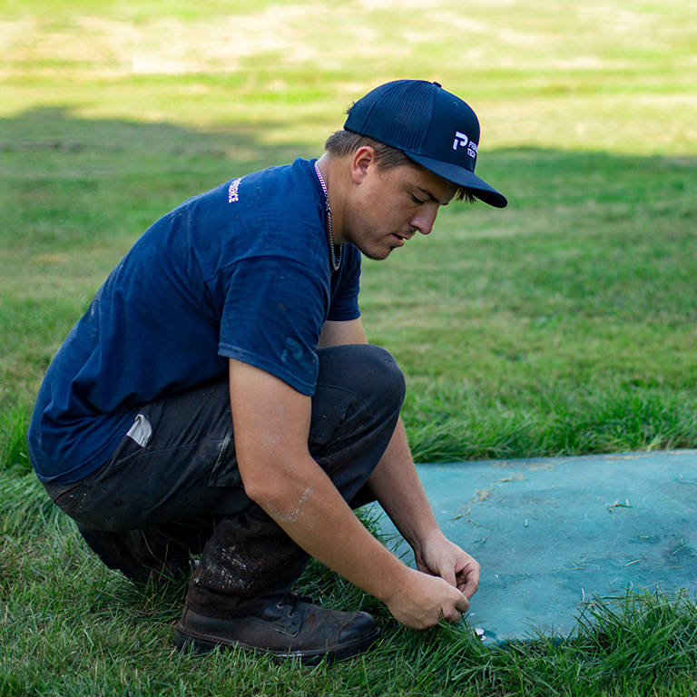 Premier Tech technician servicing the Ecoflo wastewater treatment system.
