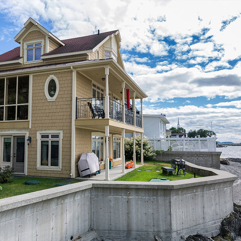 Ecoflo compact biofilter installed on a ledge on a small lot with high bedrock.