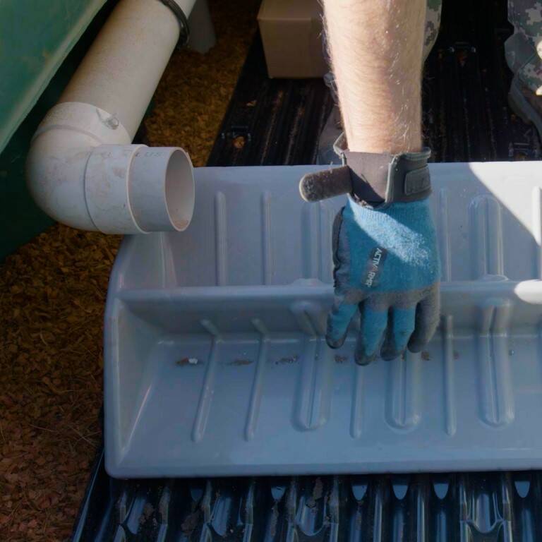 Tipping bucket and distribution plates in the Ecoflo compact biofilter.
